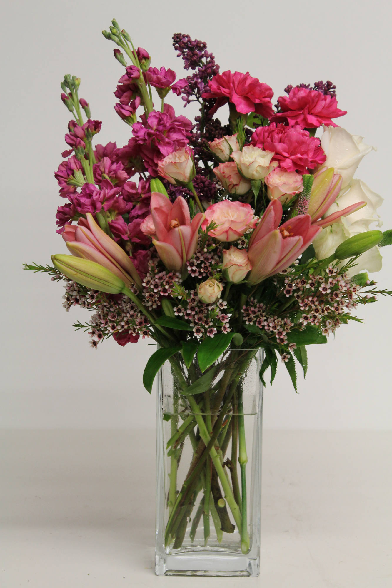 Lilac arrangements — hand-composed in the Huntington Beach atelier