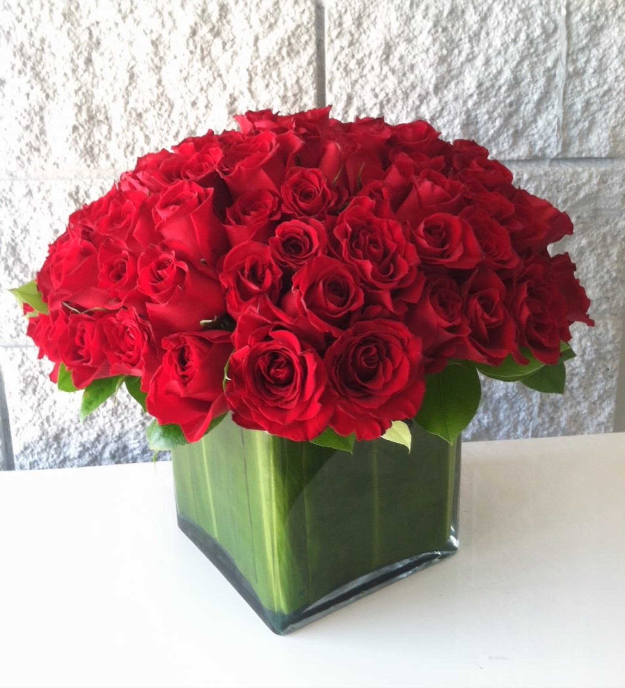 Four Dozen in a Square Glass Vase